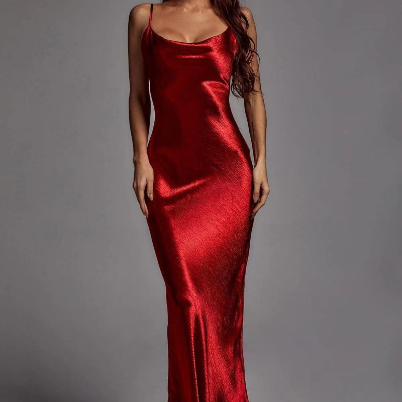 Red satin slip dress on a gray background