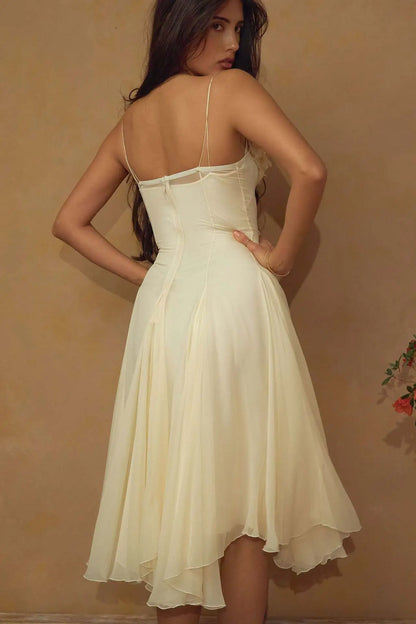 Woman wearing a white dress against a beige background