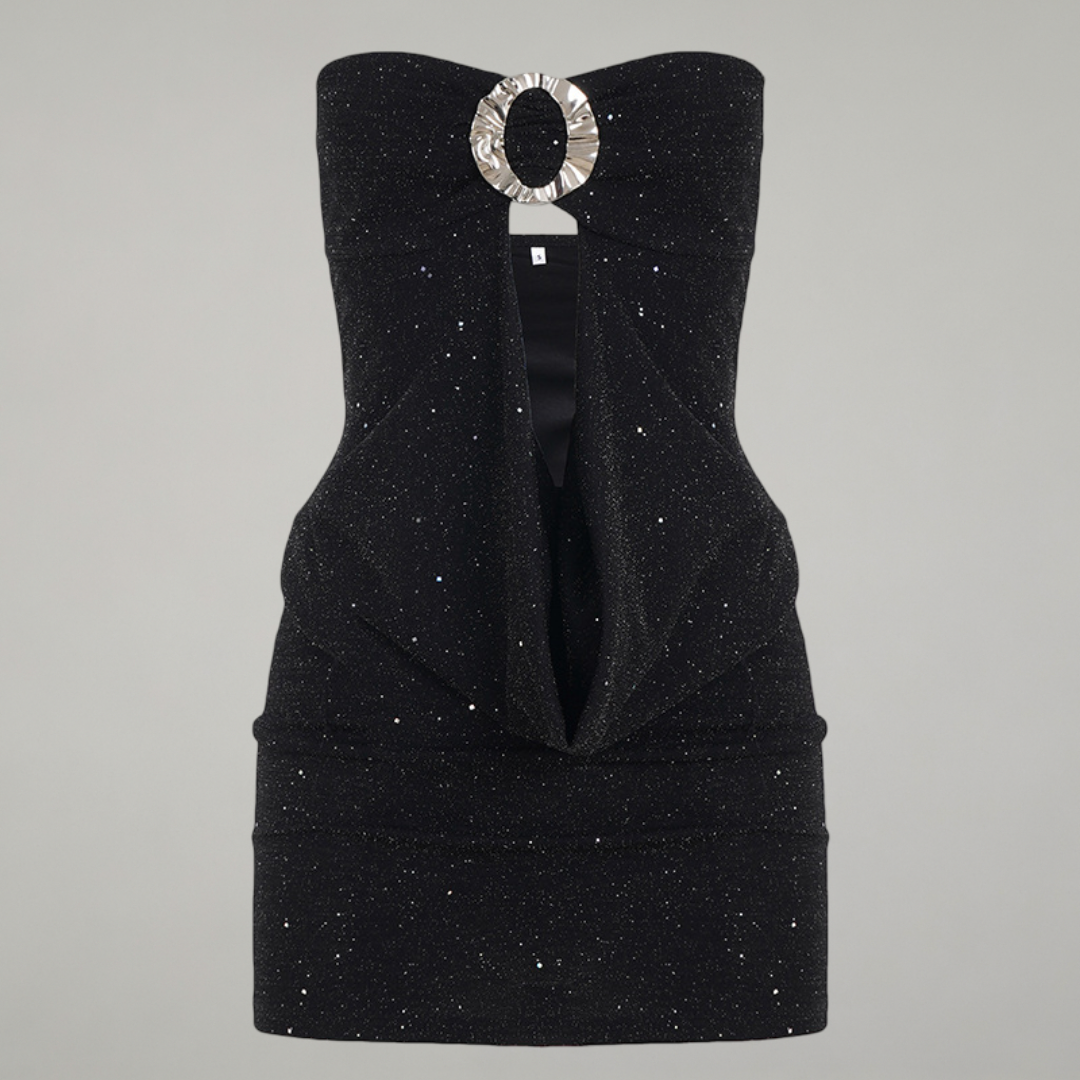 Black strapless dress with a decorative brooch on a gray background