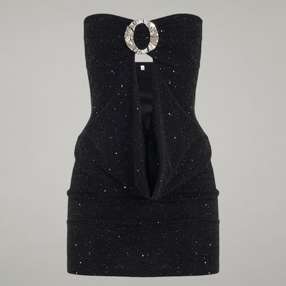 Black strapless dress with a decorative brooch on a gray background