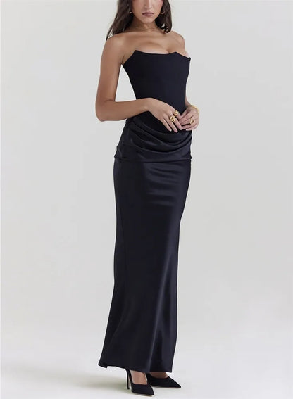 Woman wearing a black strapless gown on a white background