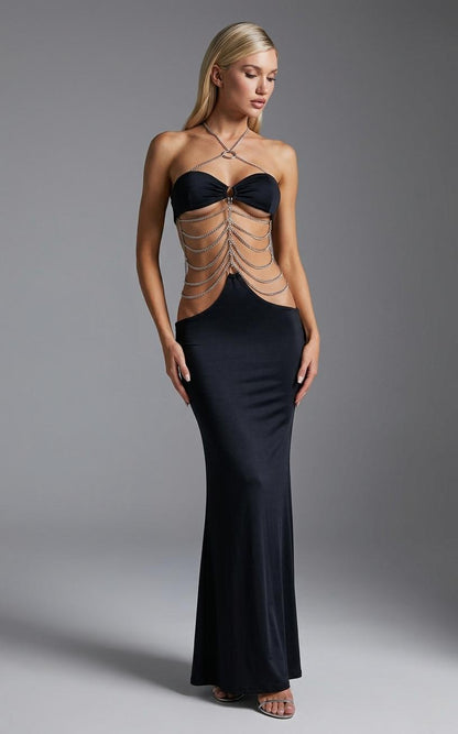Black strapless maxi dress with silver chain detailing and cutout torso
