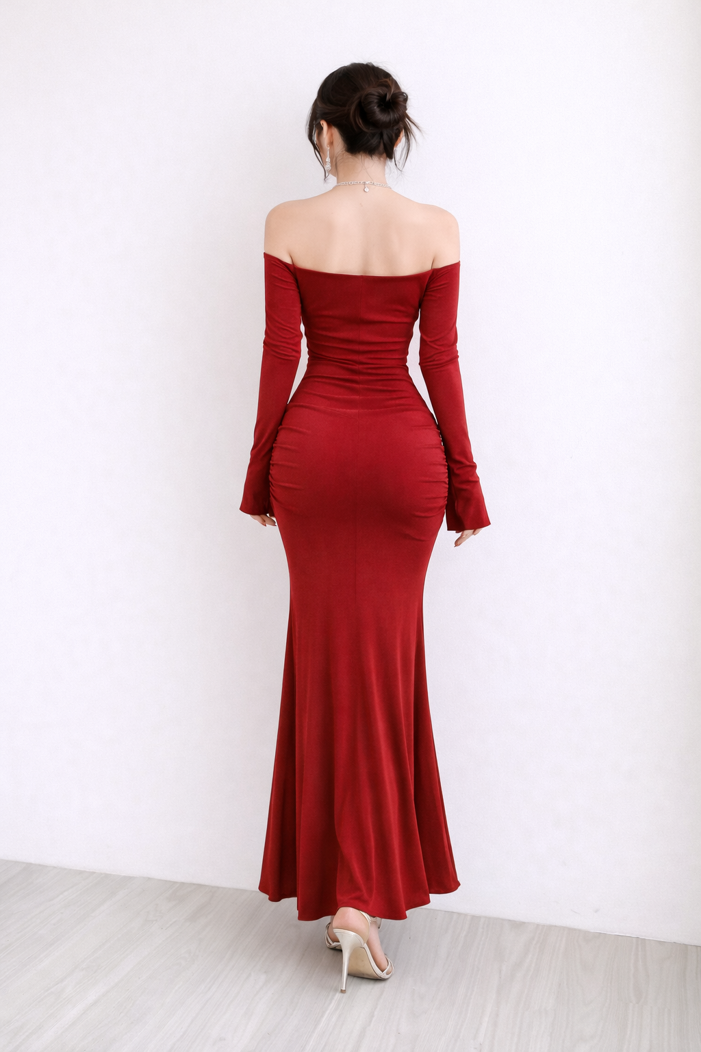 Red off-shoulder long-sleeve gown on a white background