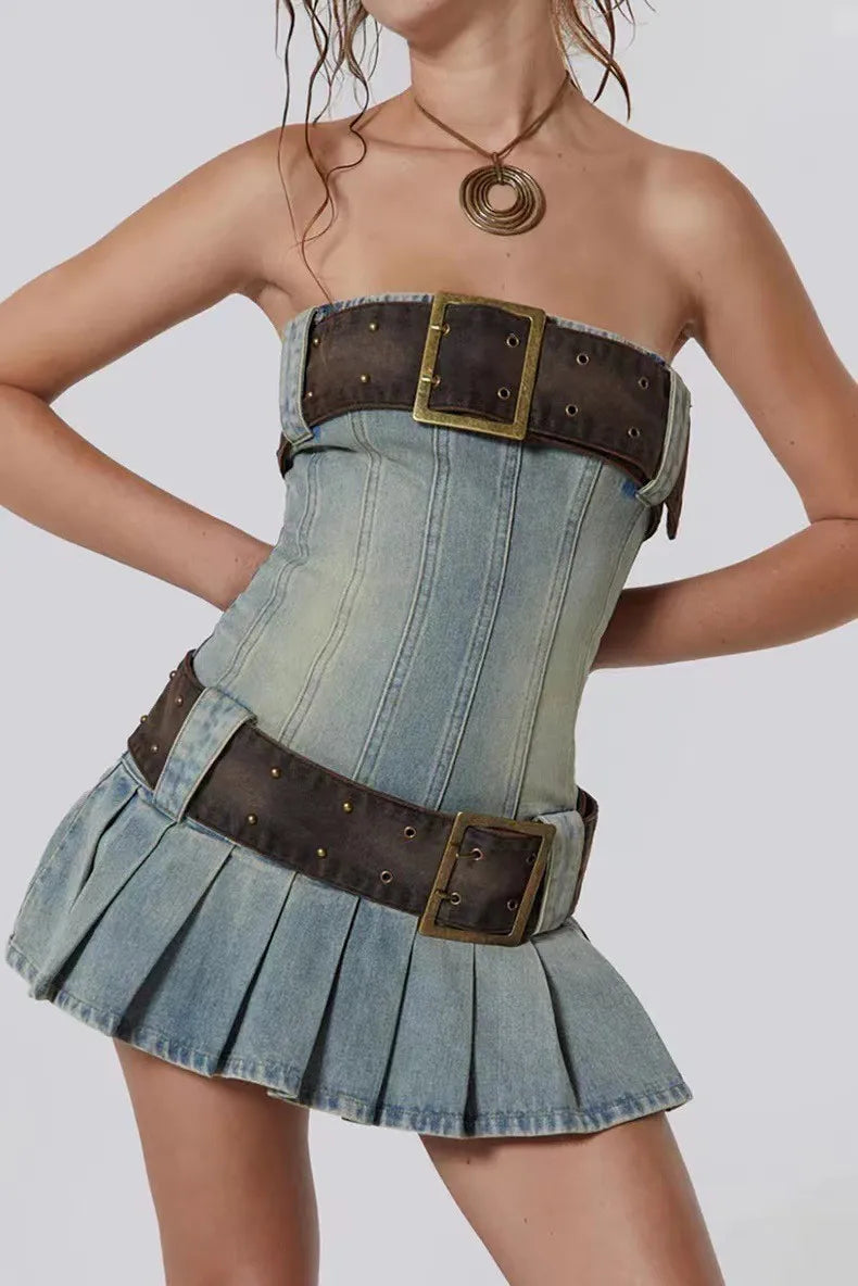 Denim corset with brown belt and buckles on a plain background