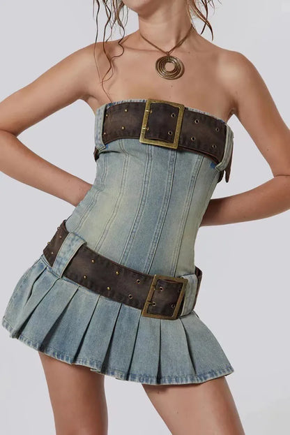 Denim corset with brown belt and buckles on a plain background
