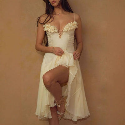 Woman wearing a white lace dress against a beige background