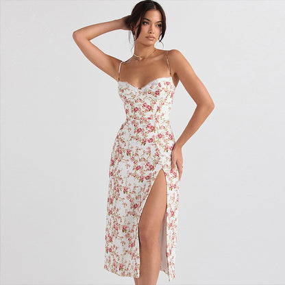 Woman wearing a floral dress with a slit on a white background