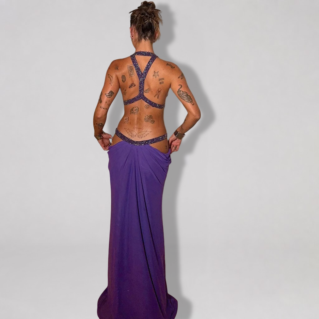 Backless halter maxi dress with metallic trim cutouts at chest and waist
