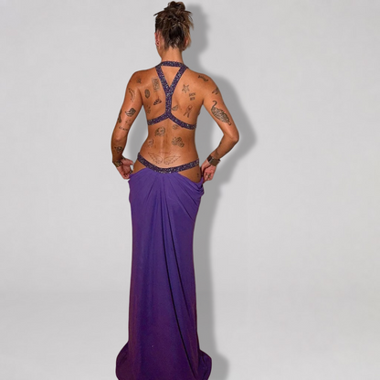Backless halter maxi dress with metallic trim cutouts at chest and waist
