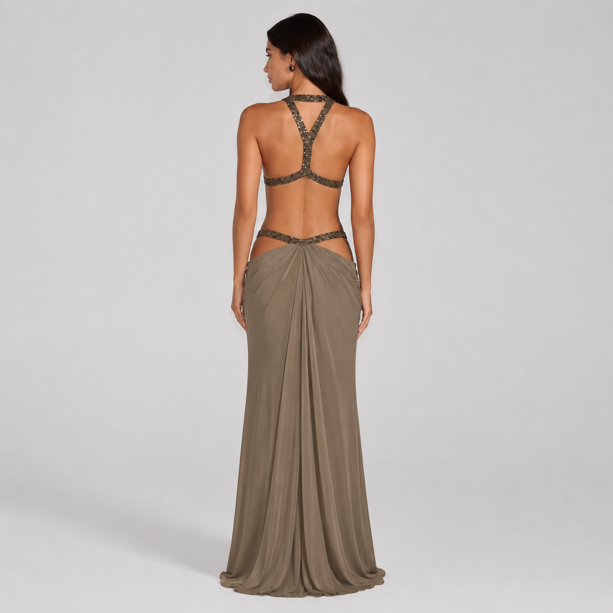 Backless halter maxi dress with metallic trim cutouts at chest and waist
