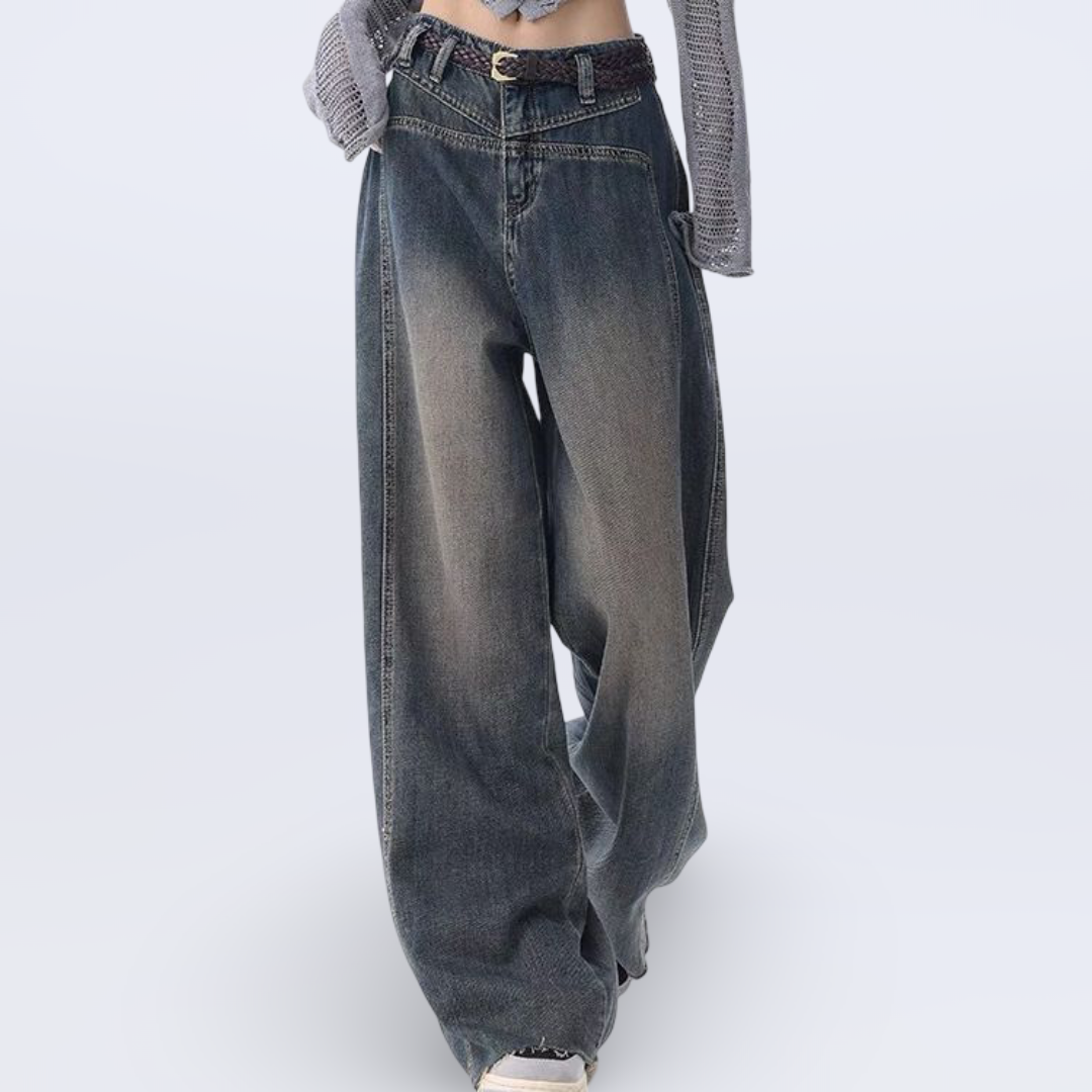 High-waisted wide-leg vintage jeans for women with raw hem and collage stitching in washed blue denim