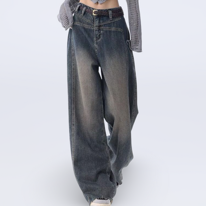 High-waisted wide-leg vintage jeans for women with raw hem and collage stitching in washed blue denim