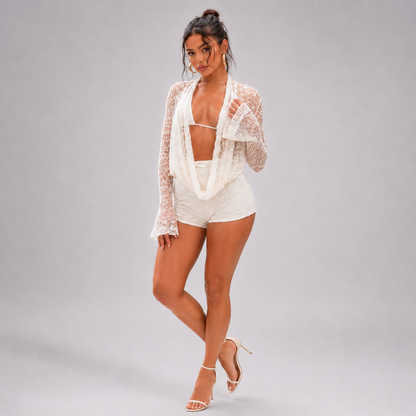 Cream lace halter set with long flare sleeves and lace-up shorts
