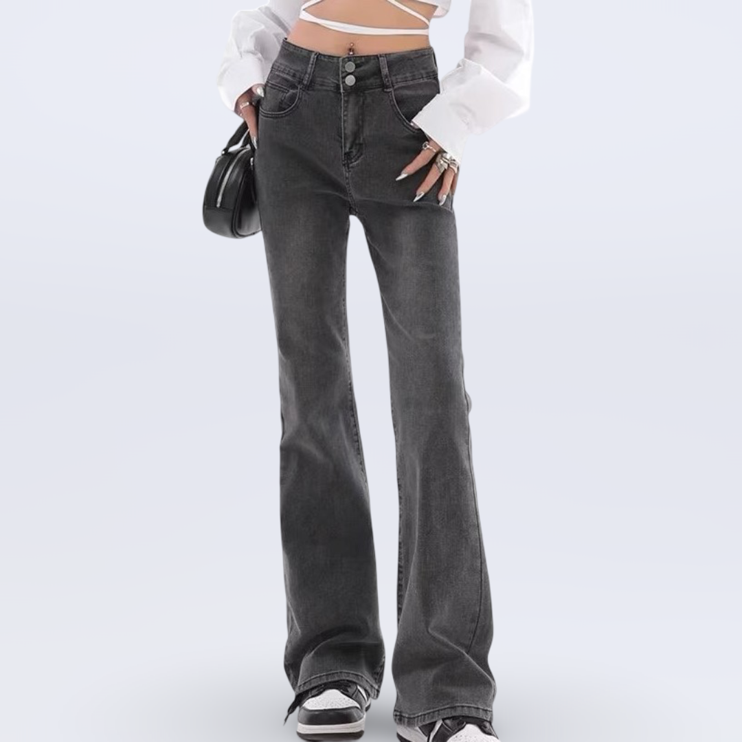 Person wearing flared jeans on a white background