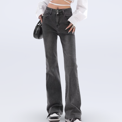Person wearing flared jeans on a white background